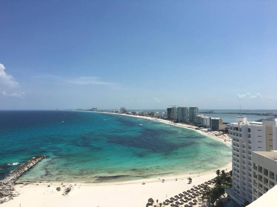 Cancun beach with clear turquoise water and minimal sargassum